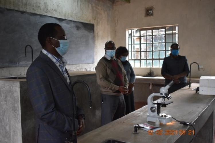 The PHPT Chairman visit to Mama Ngina High School to donate a  microscope