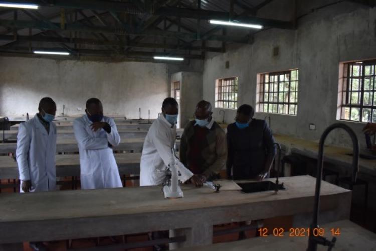 The PHPT Chairman visit to Mama Ngina High School to donate a  microscope